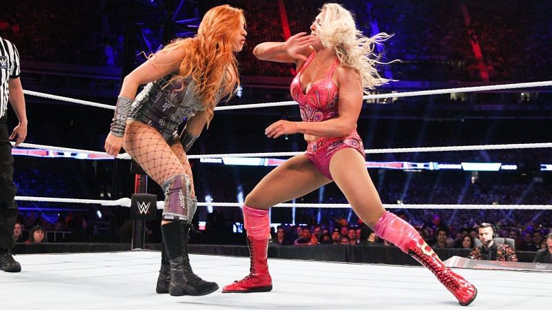 Becky Lynch and Charlotte Flair's issues with Ronda Rousey could spill over into this match.